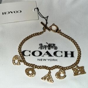 Coach Gold-Tone Charm Bracelet with Letter and Logo Accents
